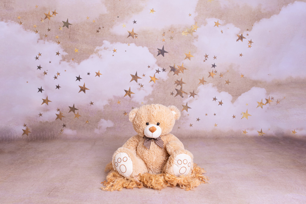 teddybär auf einem sternenhintergrund für weihnachten